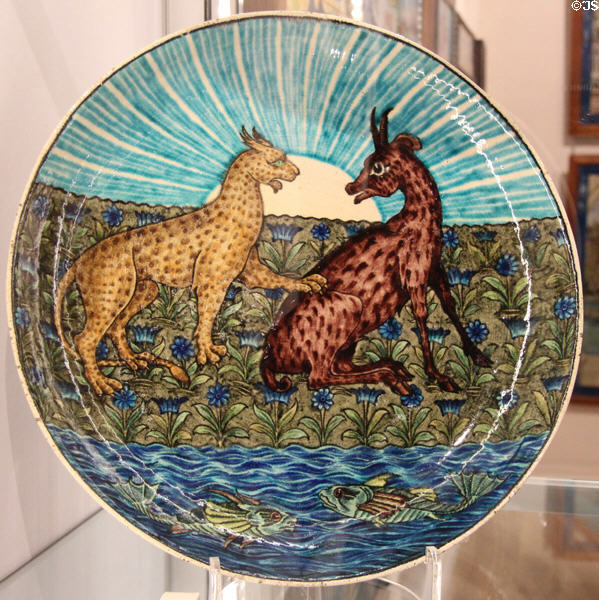 Leopard & Stag tin-glazed earthenware dish (1888-1907) by William De Morgan in private collection. England.