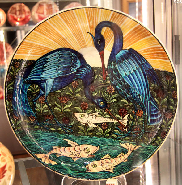 Dish with Herons & Fish tin-glazed earthenware dish (1872-1907) by William De Morgan in private collection. England.