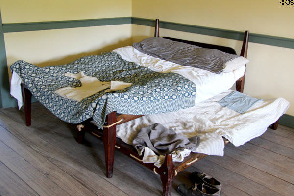 Rope bed & trundle in brick house at Ulster American Folk Park. Omagh, Northern Ireland.