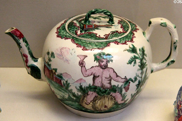 Salt-glazed punch pot enameled with Bacchus astride a barrel (c1760) made in Staffordshire at British Museum. London, United Kingdom.