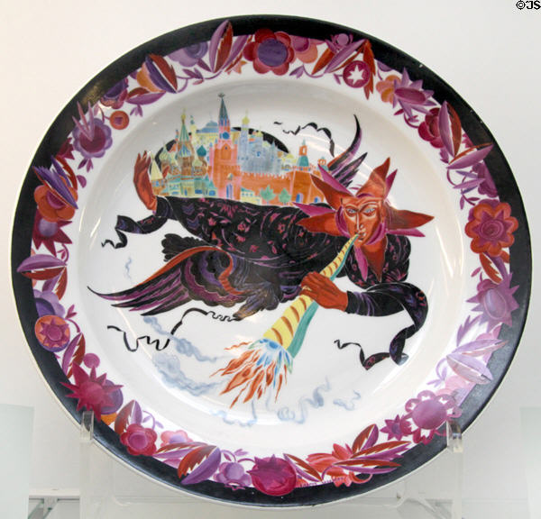 Russian porcelain plate with folk-tale figure carrying off walled city (1923) by Maria Lebedeva for SPF at British Museum. London, United Kingdom.