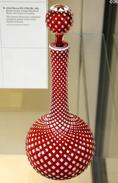 Red glass decanter with outer white layer cut away as spiral prob. shown at Great Exhibition of 1851 (c1850) by George Bacchus & Sons of Birmingham, England at British Museum. London, United Kingdom.