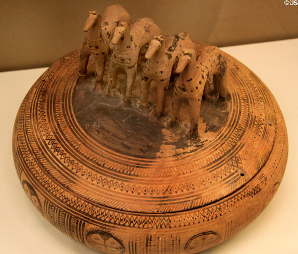 Greek Geometric terracotta Pyxis with four horses on lid (760-750 BCE) made in Athens at British Museum. London, United Kingdom.