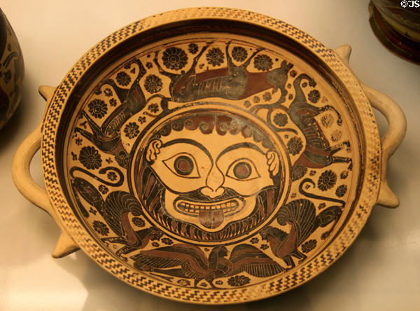 Corinthian pottery bowl painted with gorgon's head ringed by frieze of deer & mythical animals (610-590 BCE) attrib. Medallion Painter from Kamiros, Rhodes at British Museum. London, United Kingdom.