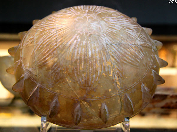 Glass bowl with band of bosses & with rosette cut on bottom (c225-200 BCE) made in eastern Mediterranean at British Museum. London, United Kingdom.