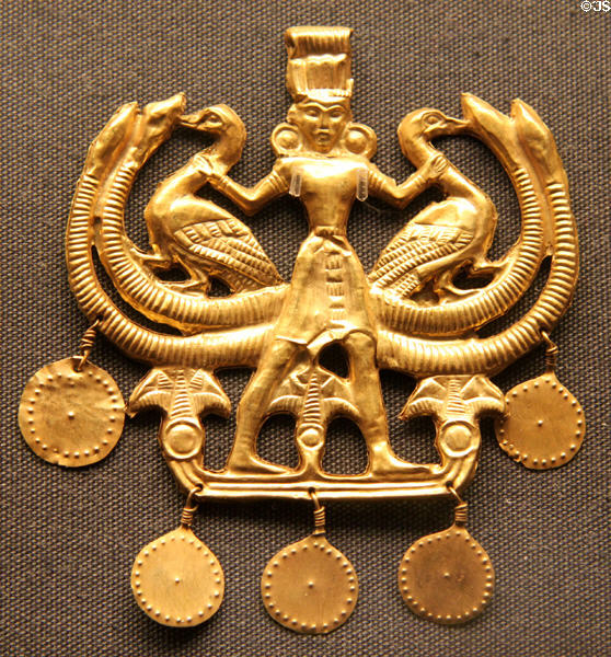 Sheet gold pendant of Cretan nature god wearing Minoan kilt (1850 BCE - 1550 BCE) at British Museum. London, United Kingdom.
