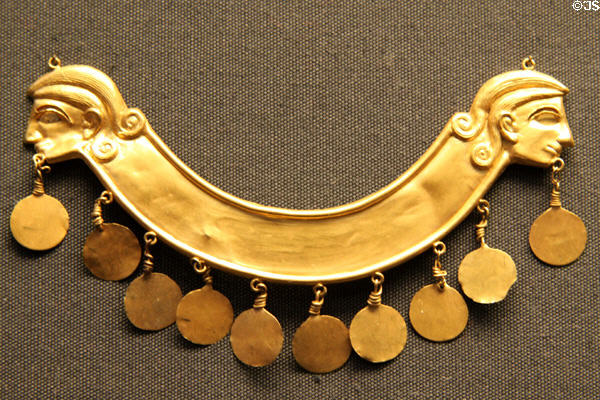 Minoan gold breast ornament with human profiles & pendant discs (1850 BCE - 1550 BCE) made in Crete(?) at British Museum. London, United Kingdom.
