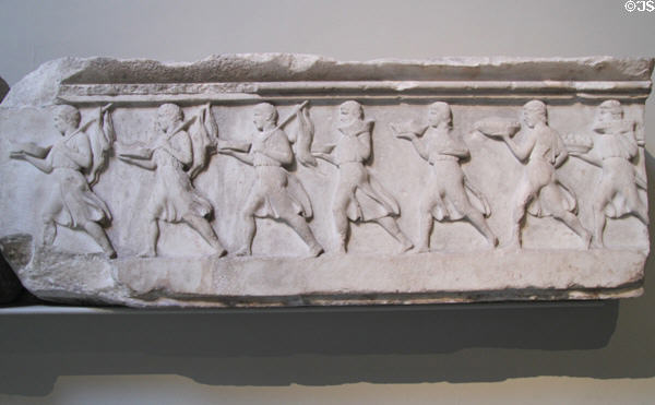 Architrave frieze showing young men rushing forward with food & wine for a feast on Nereid Monument (390 BCE-380 BCE) at British Museum. London, United Kingdom.