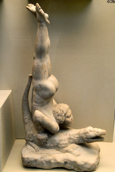 Roman marble sculpture of African acrobat diving onto a crocodile (1stC BCE or 1stC CE) a popular entertainment at British Museum. London, United Kingdom.
