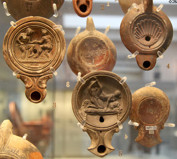 Collection of Roman oil lamps (1stC-2ndC CE) made in Italy & France at British Museum. London, United Kingdom.