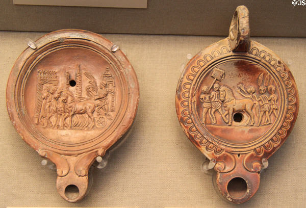 Roman oil lamps showing victorious chariot teams (1stC CE) made in Italy at British Museum. London, United Kingdom.