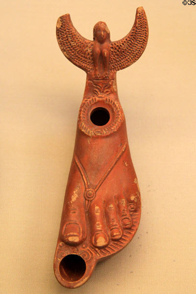 Terracotta oil lamp in form of sandaled foot (c50-100 CE) made in Italy, found in Libya at British Museum. London, United Kingdom.