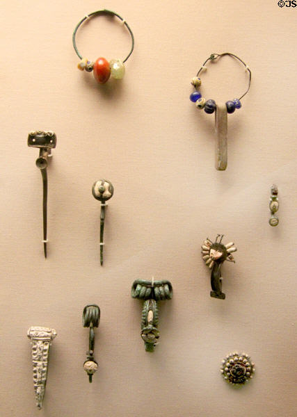 Celtic culture brooches & pins of bronze with beads (500-100 BCE) from England & France at British Museum. London, United Kingdom.