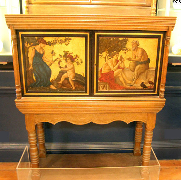 Music cabinet (1870s) with painted doors by William De Morgan for Morris & Co at Morris Gallery. London, United Kingdom.