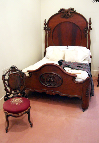 Carved wooden 3/4 bedstead by Prudent Mallard (with his trademark egg on top) at Bragg-Mitchell Mansion. Mobile, AL.