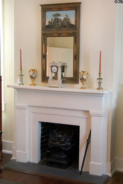 Fireplace with mantle clock, urns & mirror at Conde-Charlotte Museum. Mobile, AL.