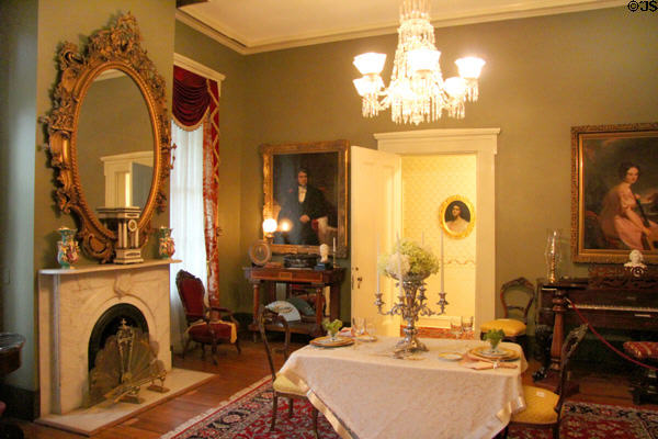Back parlor with marble fireplace & piano at Oakleigh Plantation. Mobile, AL.