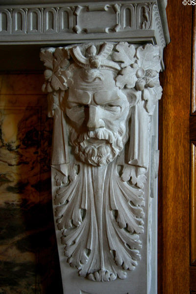 Arts & crafts style carving of a French settler on fireplace in Governor's Reception Room of Arkansas State Capitol. Little Rock, AR.