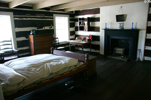 Bedroom with log walls upstairs over Hinderliter Grog Shop at Historic Arkansas Museum. Little Rock, AR.