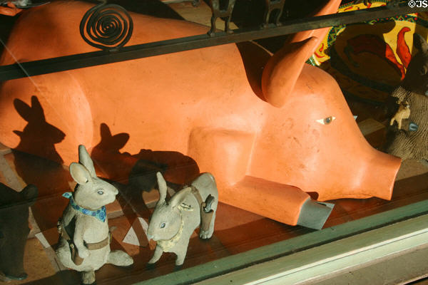 Cowboy rabbits & pig in shop window at Pedregal Plaza Festival Marketplace. Scottsdale, AZ.