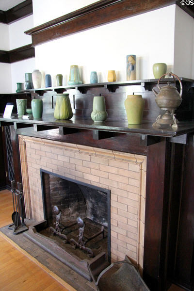 Living room fireplace with collection of Arts & Crafts era pottery in Corbett House at Tucson Museum of Art. Tucson, AZ.