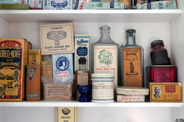 Bathroom cabinet with antique pill & tonic boxes in Corbett House at Tucson Museum of Art. Tucson, AZ.