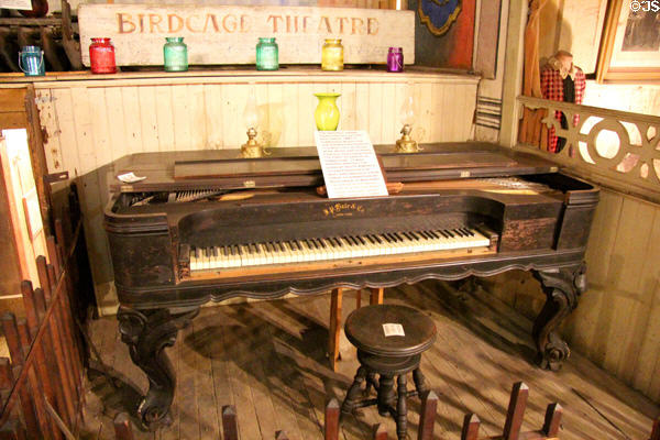 Original square grand piano which sat on this spot since 1881 & which was ship around Cape Horn to San Francisco & then shipped overland by mule train at Bird Cage Theatre. Tombstone, AZ.