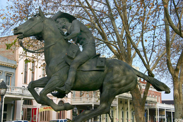 Pony Express monument against the Victorian buildings of Old Sacramento. Sacramento, CA.