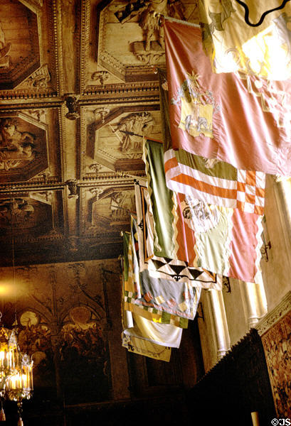 Antique flags grace dining hall of Hearst Castle. CA.