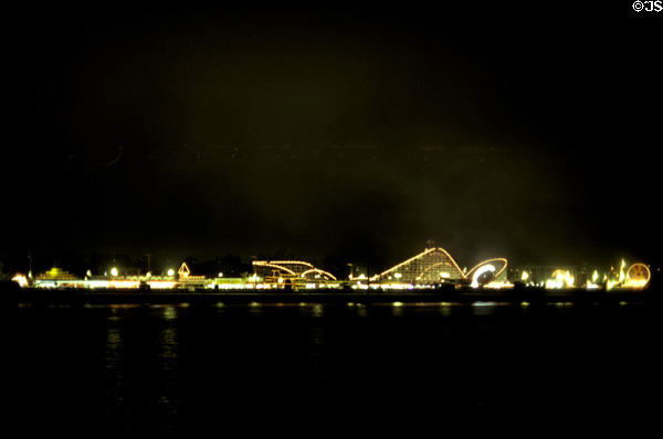Roller coasters on Santa Cruz pier at night. Santa Cruz, CA.