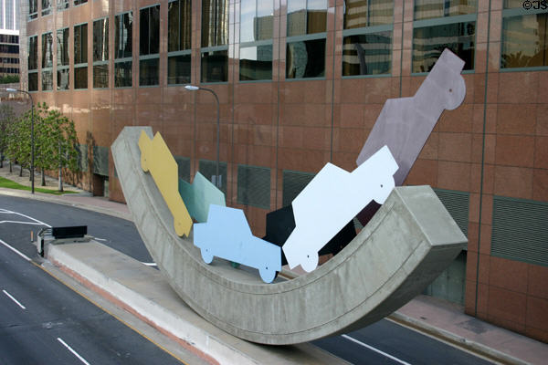 Car silhouettes on a rocking base sculpture at base of Wells Fargo Tower. Los Angeles, CA.