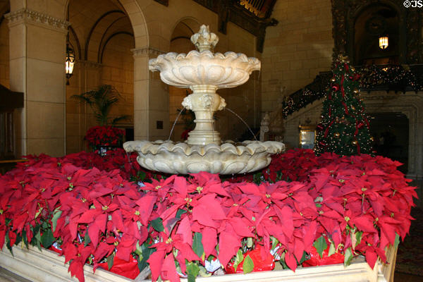 Entrance lobby fountain with poinsettias of Biltmore Hotel. Los Angeles, CA.