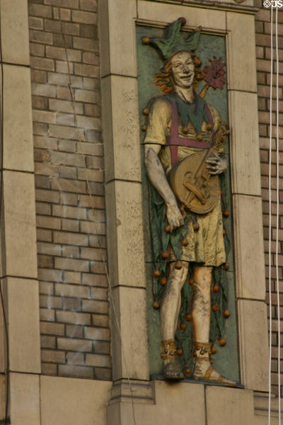 Terra-cotta panel of medieval string player on Palace Theater. Los Angeles, CA.