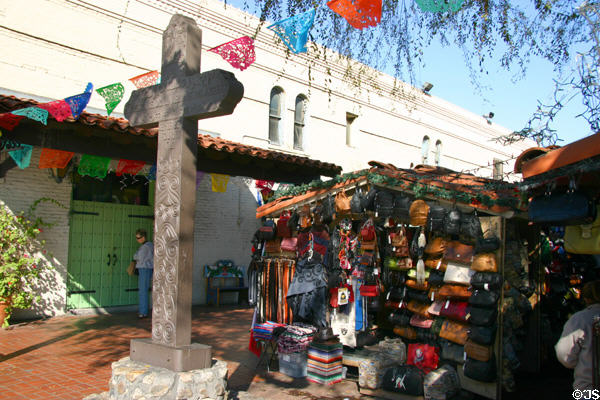 Cross to founding of Los Angeles & stall of Mexican goods. Los Angeles, CA.