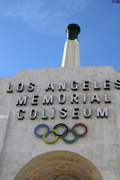 Olympic torch tower over central entrance arch of Memorial Coliseum. Los Angeles, CA.