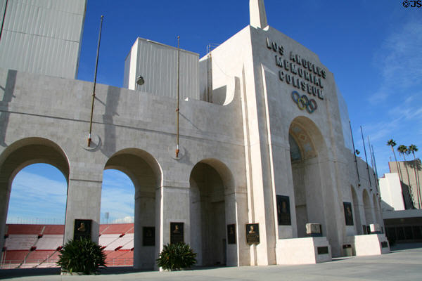 Row of arches forming entrance of Memorial Coliseum with seating beyond. Los Angeles, CA.