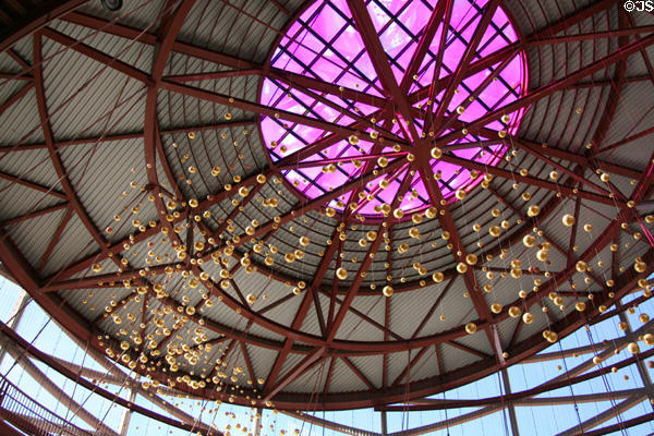 California Science Center atrium with celestial bodies suspended from metal lattice. Los Angeles, CA.