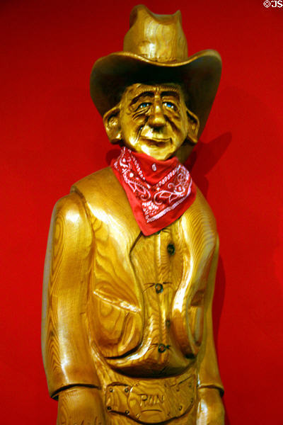 Wood caricature sculpture of Ronald Reagan in cowboy hat by R. Kowolski at Reagan Museum. Simi Valley, CA.