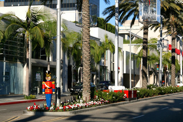 Streetscape up Via Rodeo with palms & flowers. Beverly Hills, CA.