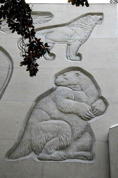 Carved relief of ancient lion & ancient giant ground sloth on facade of Hancock Foundation building at USC. Los Angeles, CA.