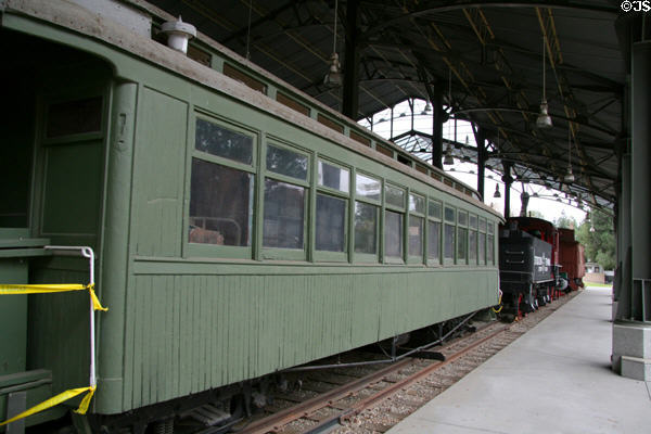 Passenger car under iron platform shelter at Travel Town Museum. Los Angeles, CA.