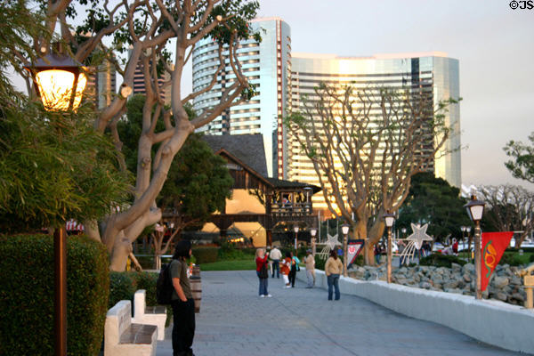 Walkway along Seaport Village plus curved Marriott Hotel. San Diego, CA.