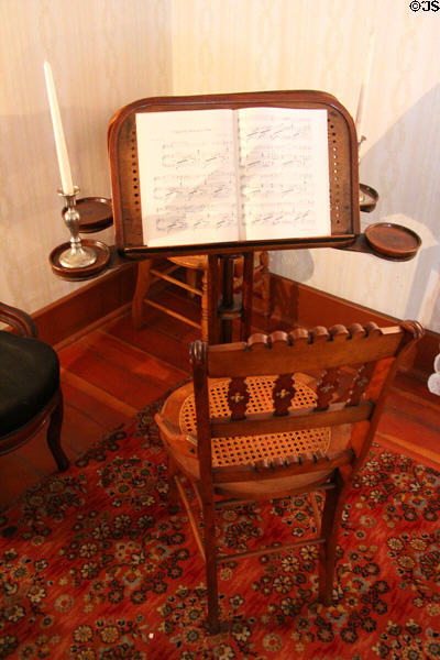 Double music stand with four candle holders at Davis House Museum. San Diego, CA.