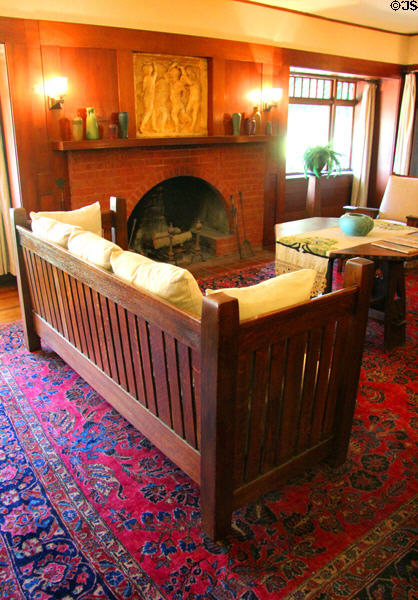Arts & crafts wooden straight-backed parlour sofa at Marston House Museum. San Diego, CA.