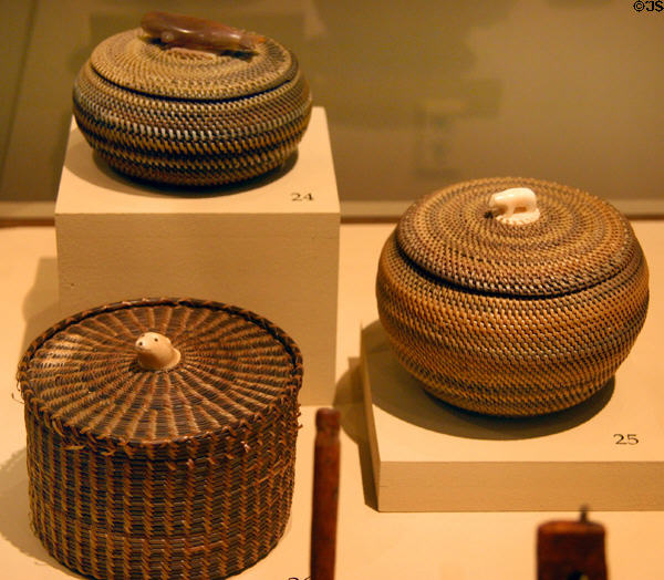Inuit baskets with carved animal handles (early 20th C) from Alaska at San Diego Museum of Man. San Diego, CA.