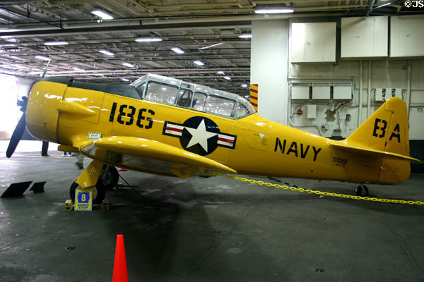 North American Aviation SNJ prop trainer (1940s & 50s) at Midway aircraft carrier museum. San Diego, CA.
