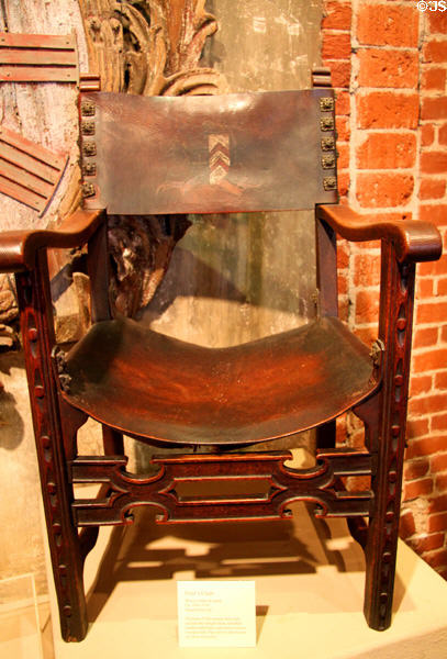 Spanish Revival friar's arm chair (sillón de frailero) (c1920-30) with leather sear & back at Mission Inn Museum. Riverside, CA.