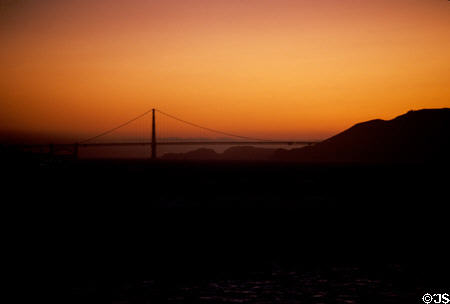 Red sunset against pylon of Golden Gate Bridge. San Francisco, CA.