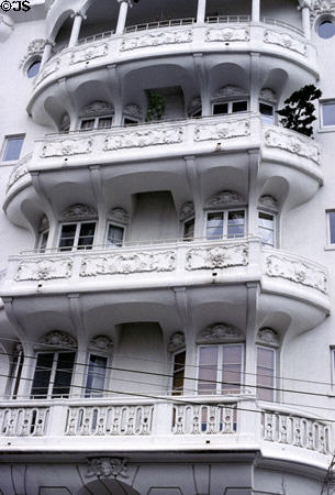 Elaborate balconies of building at corner of Sacramento & Jones. San Francisco, CA.