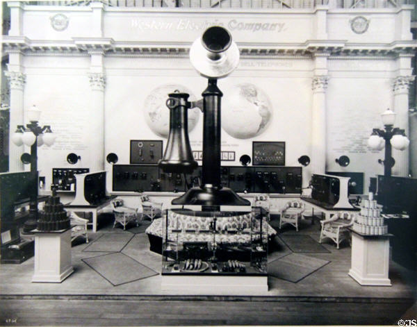 Print of Palace of Manufactures exhibit by Western Electric shows giant candlestick telephone at Panama-Pacific International Exposition (1915) in private collection. San Francisco, CA.